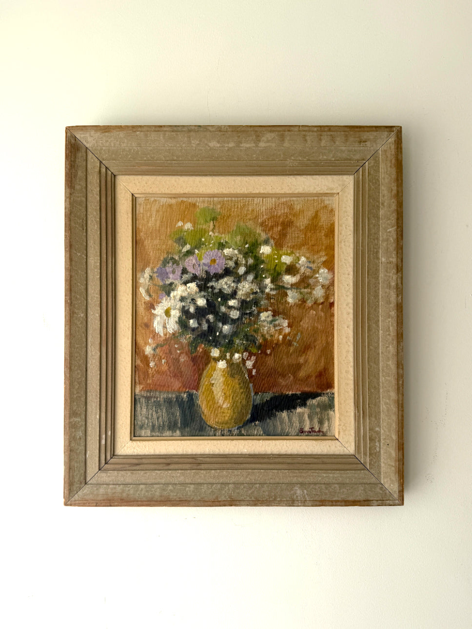 Framed vintage oil painting of a still life with flowers and a vase. Available at Hue. 