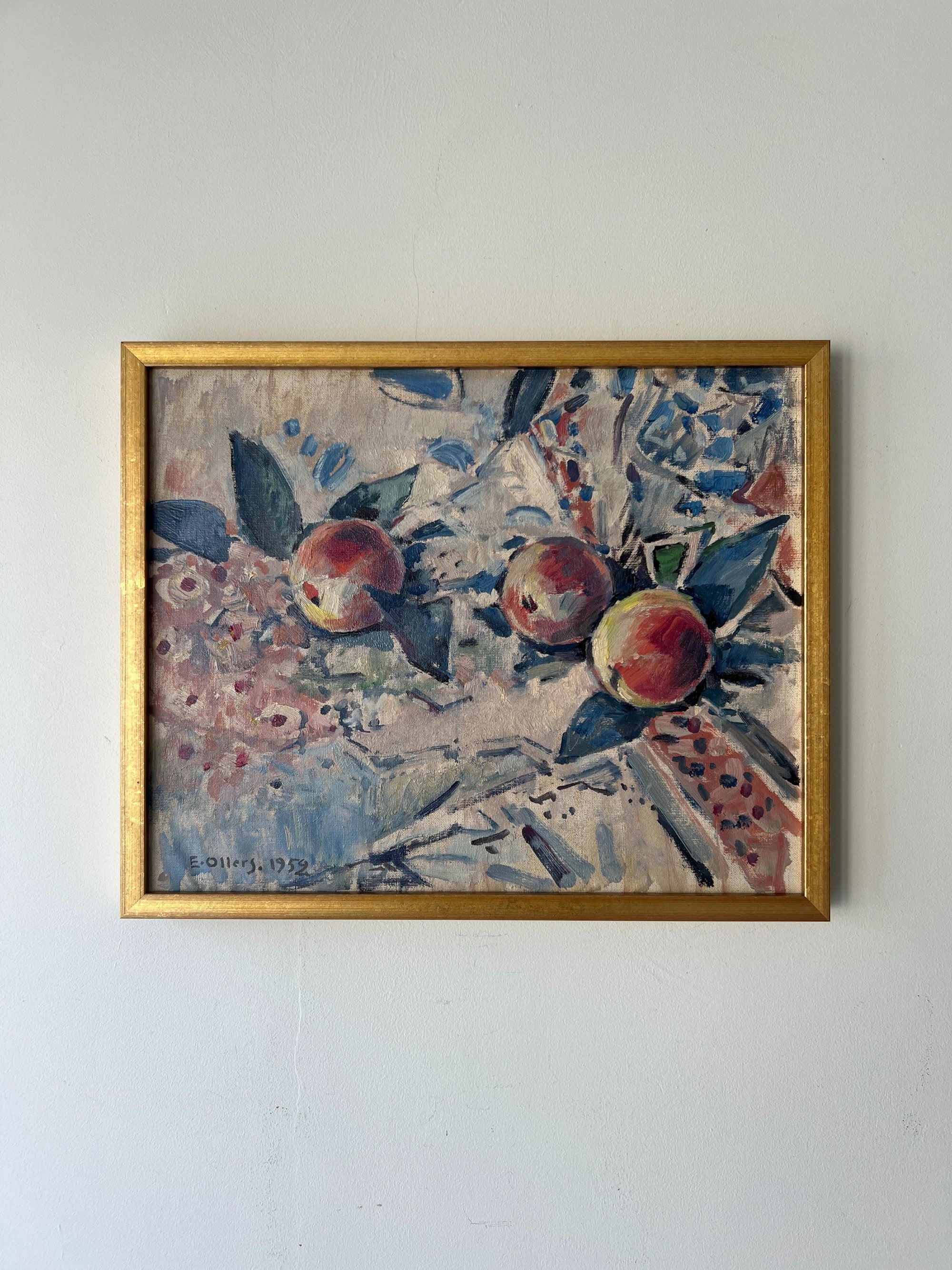 Framed vinatge still-life artwork with apples and floral patterns. Available at Hue. 