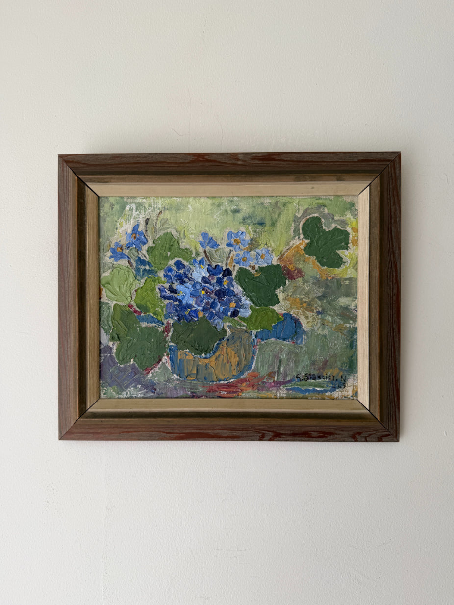 Framed vintage oil painting of flowers in a pot. Available at Hue. 