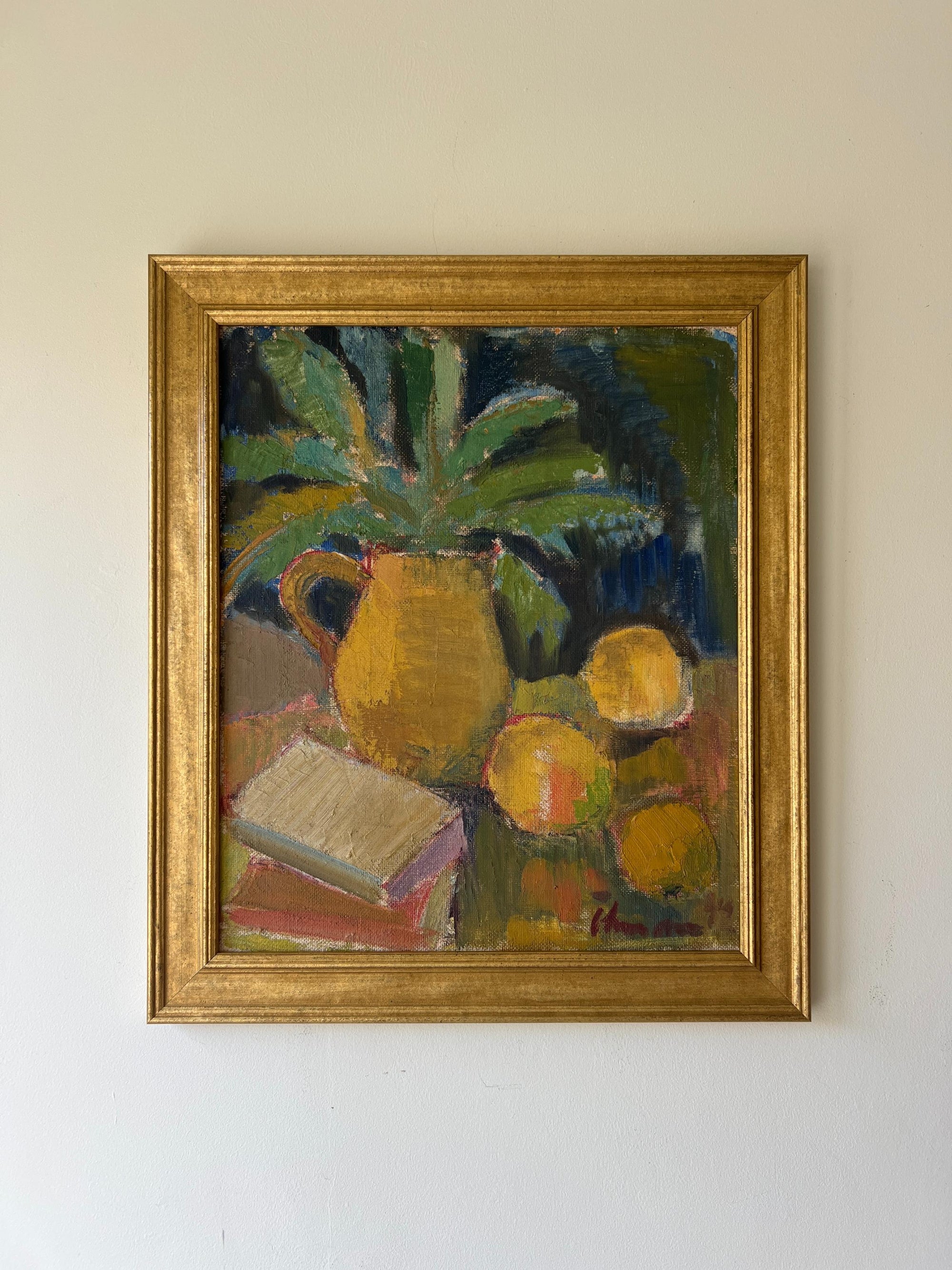 Framed vintage oil painting of a jug and lemons in ochre tones. Available at Hue. 