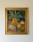 Framed vintage oil painting of a jug and lemons in ochre tones. Available at Hue. 