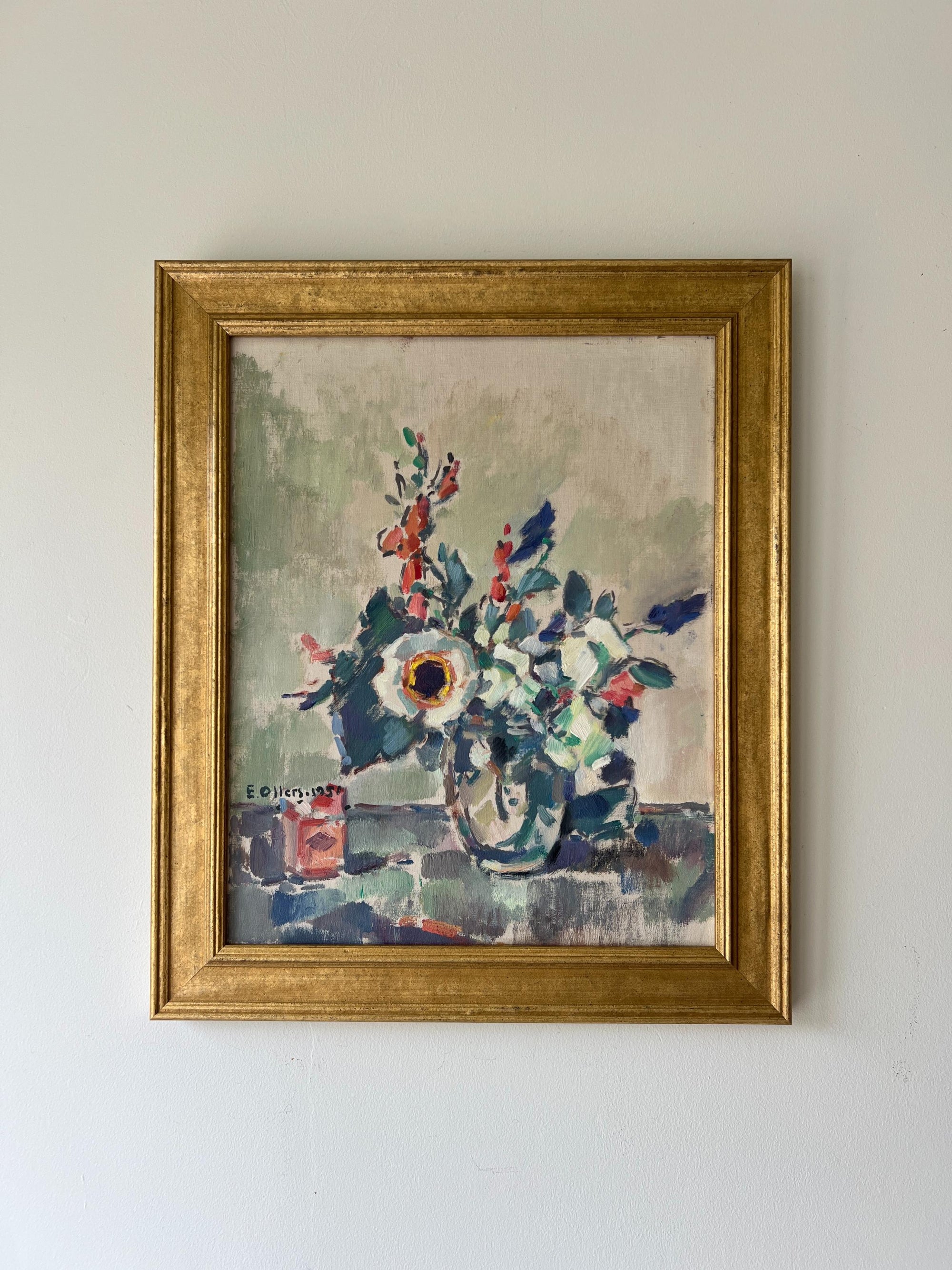 A framed vintage oil painting of a bouquet of Anemones in a glass vase. Available at Hue. 