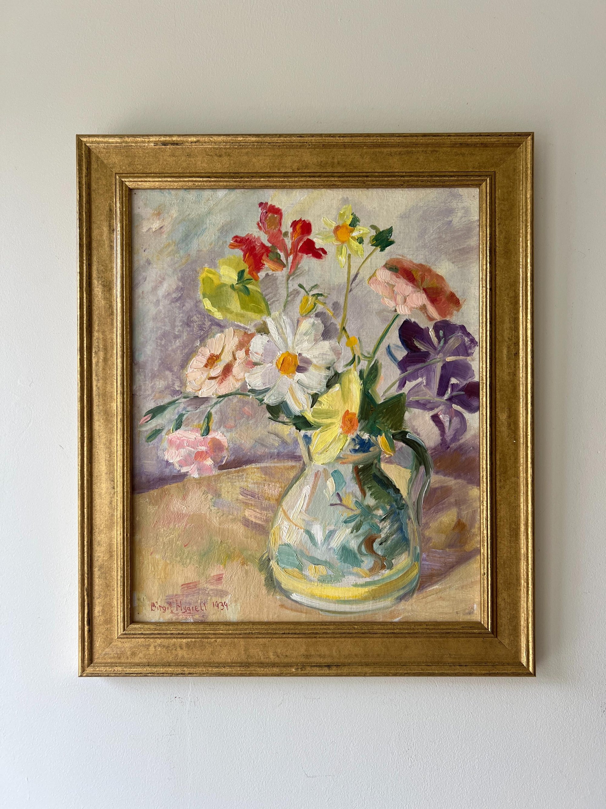 Framed vintage oil painting of a vase with colorful flowers in a gilt frame, available at Hue.