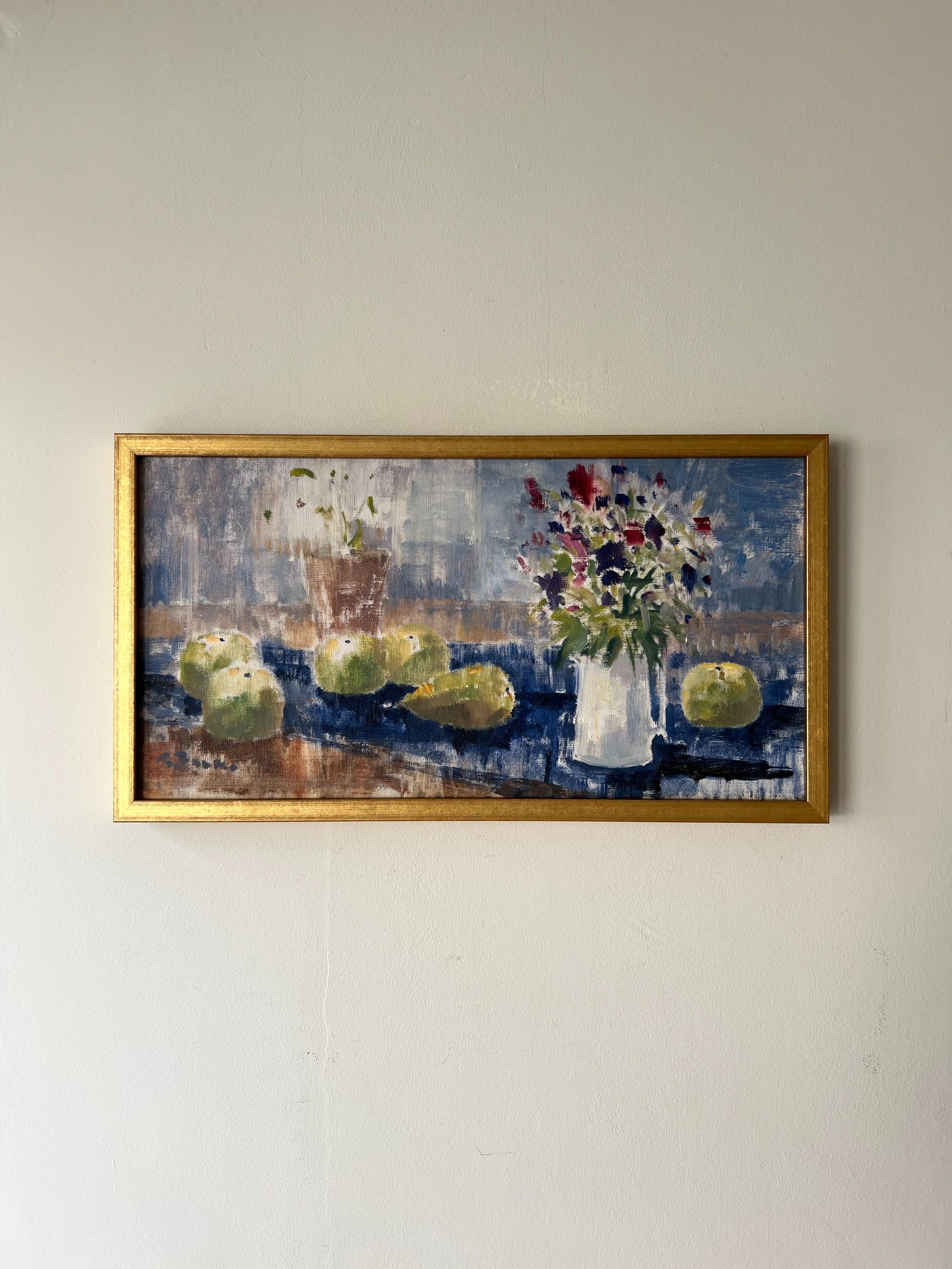 Framed vintage oil painting of a bouquet of flowers next to some scattered fruit, available at Hue.
