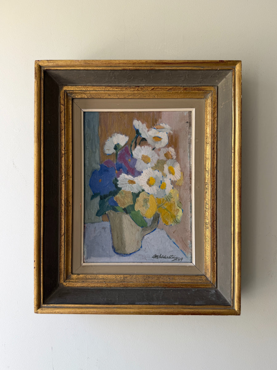 Framed vintage oil painting of flowers in a ceramic jug. Available at Hue. 