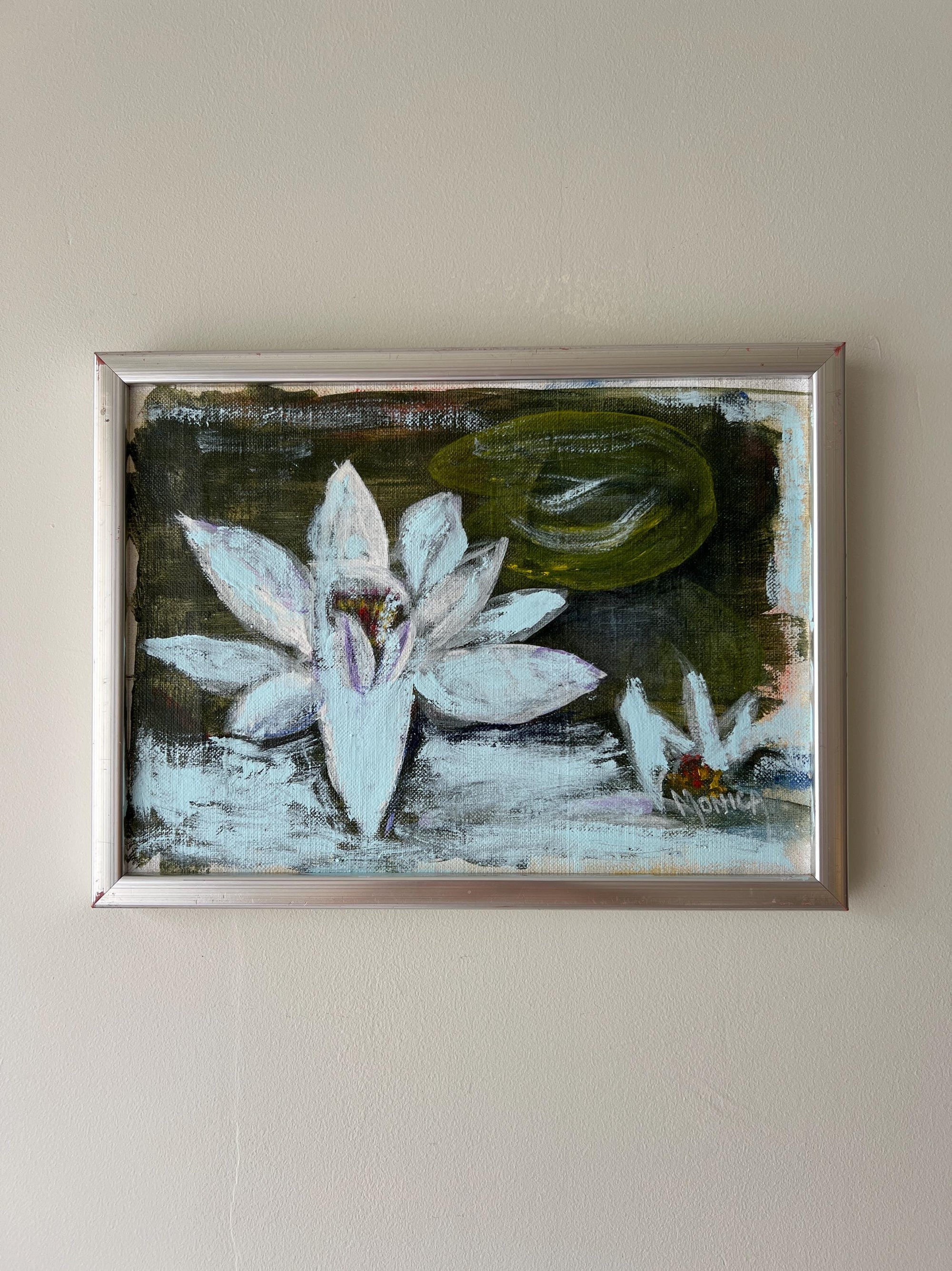 Framed vintage artwork of water lilies in a silver frame, available at Hue.