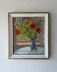 Framed vintage oil painting of wild flowers in a vase by a window. Available at Hue.
