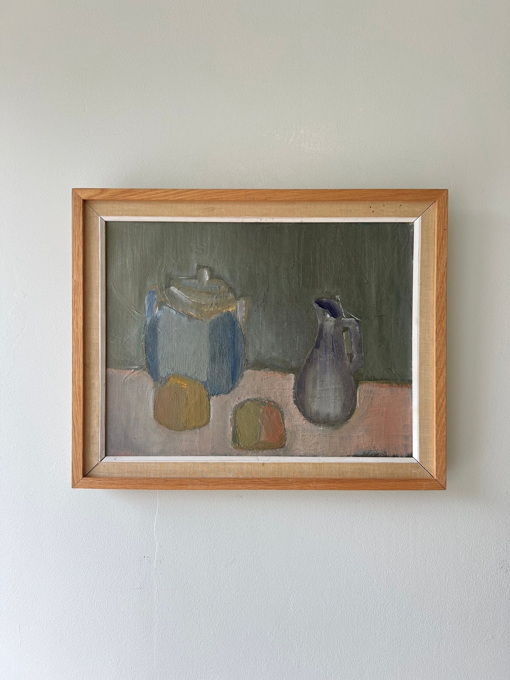 Framed painting of vessels and fruit in a vintage frame, available from hue
