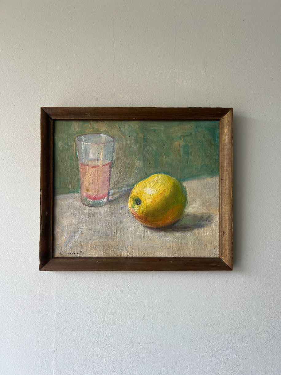 Framed vinatge oil painting of a glass and lemon. Available at Hue.
