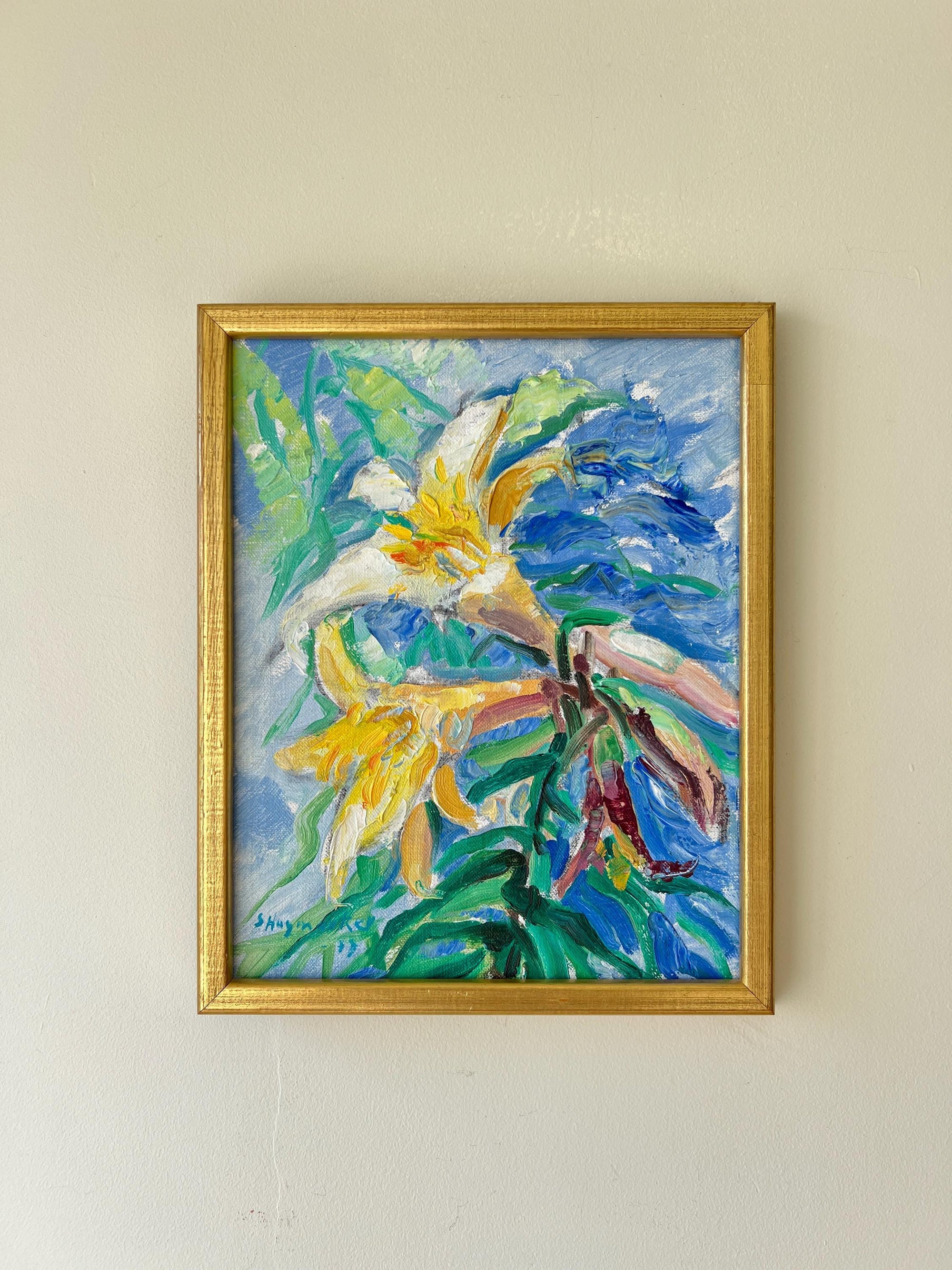 Framed vintage oil painting of lily flowers in a gilt frame, available at Hue.