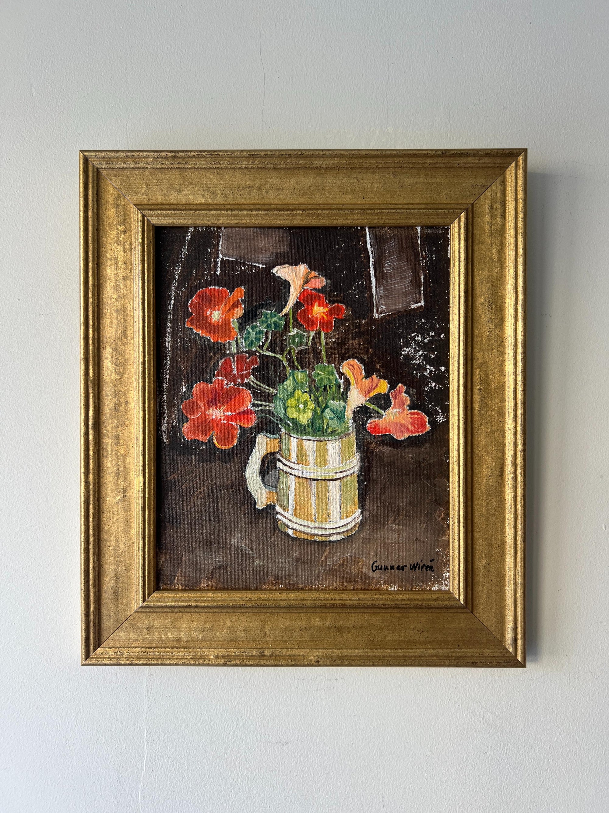 Framed vintage oil painting of nasturtium flowers in a striped vase. Available at Hue. 