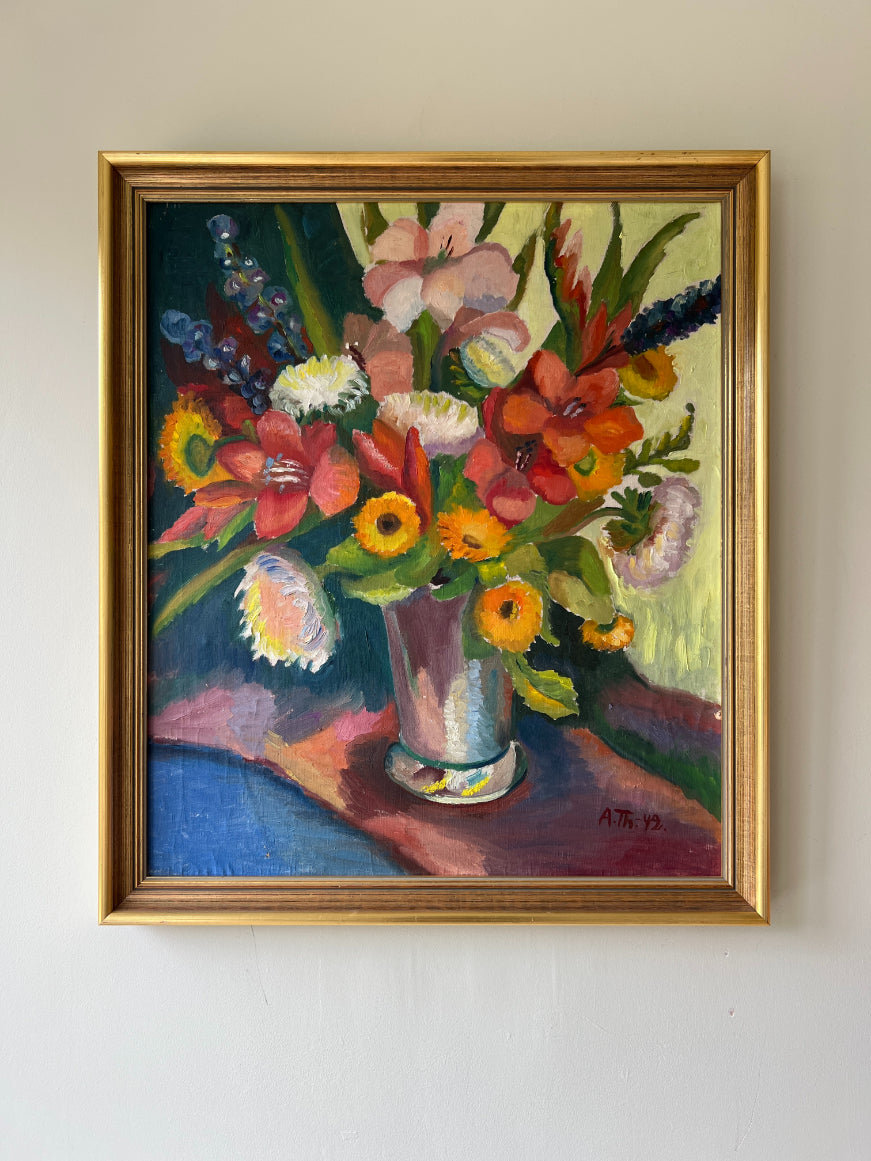 Framed vintage oil painting of a colorful bouquet of flowers. Available at Hue. 