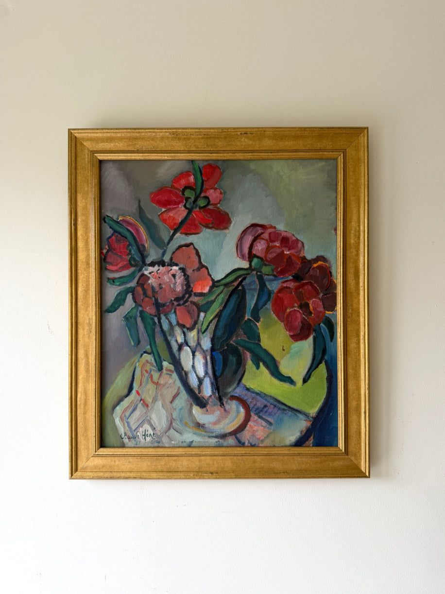 Framed vinatge oil painting of red flowers in a decorative vase. Available at Hue. 
