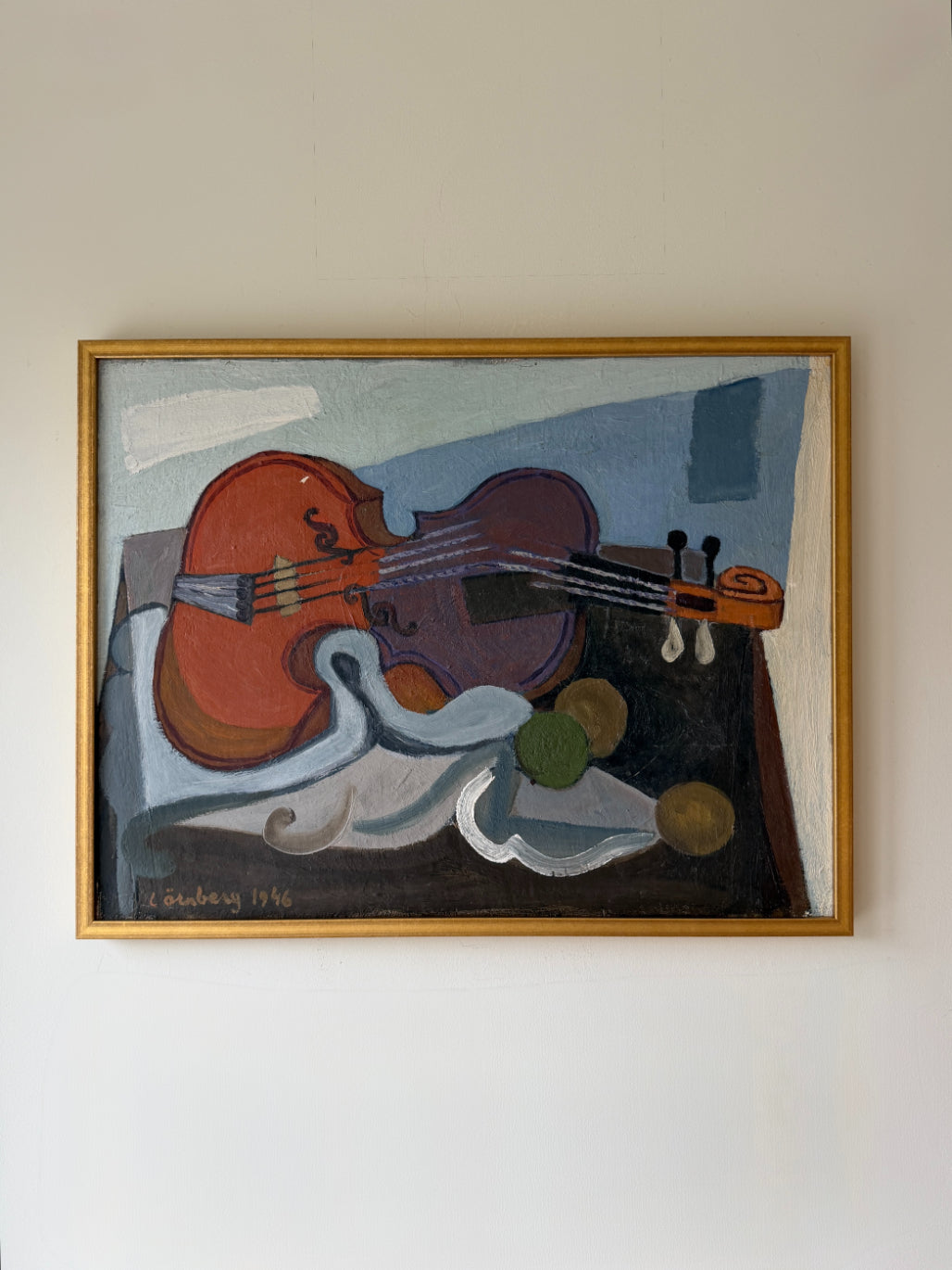 Framed vintage oil painting of a still life with a violin on a table. Available at Hue.