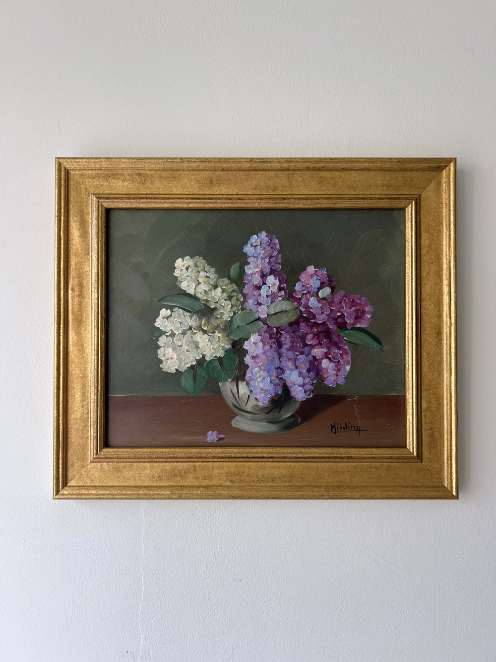 Framed, vintage artwork of purple and white flowers on a dark background, available at Hue.