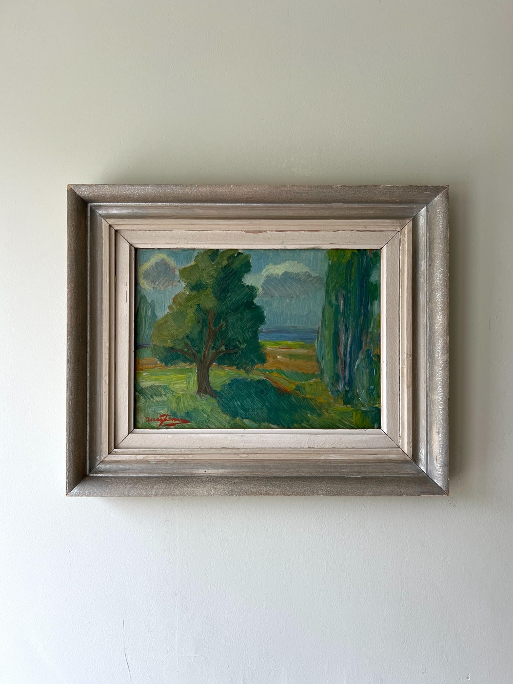 Framed vintage oil painting of a landscape with trees and a field in a vintage frame, available at Hue.