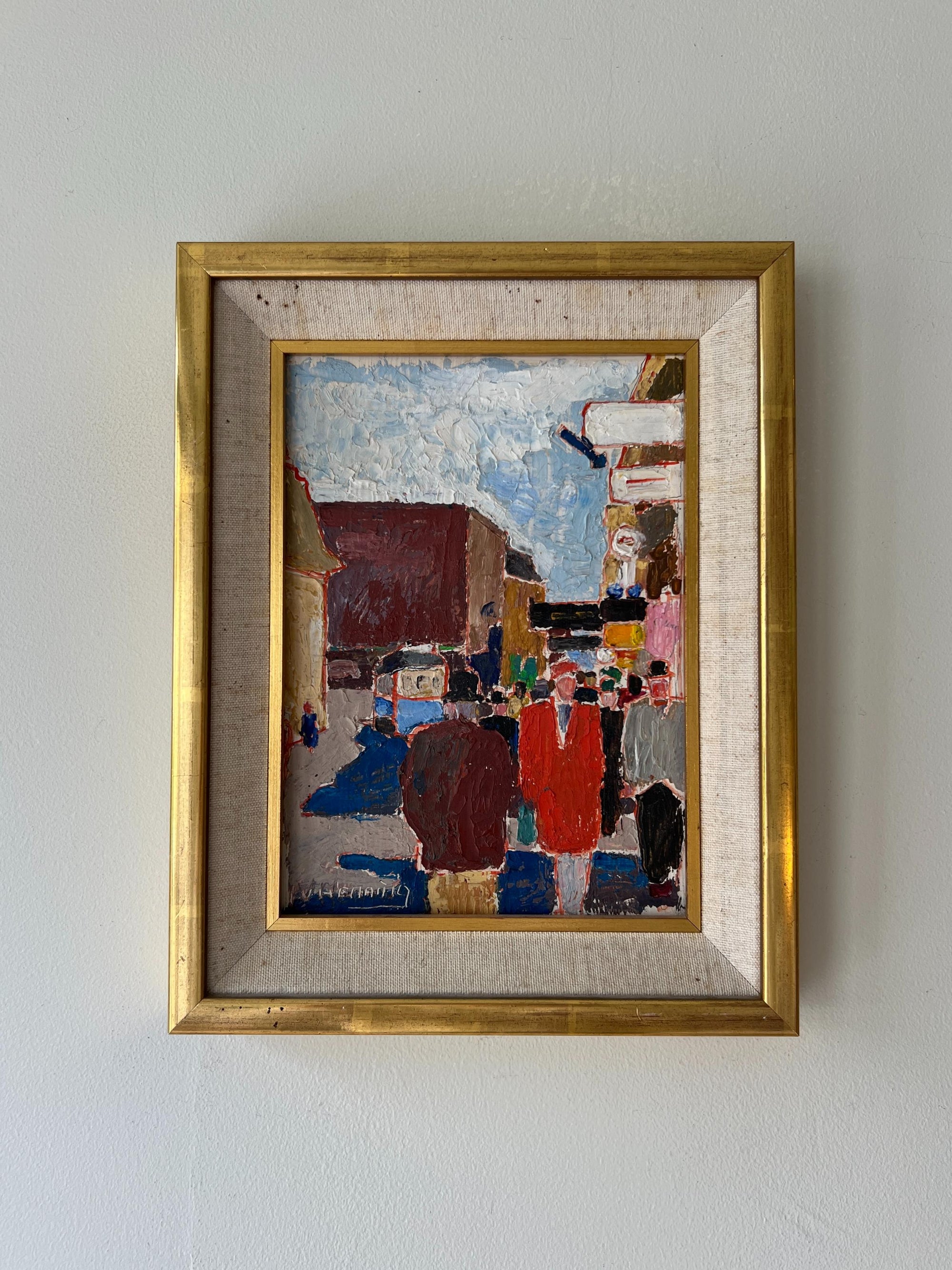 A vivid framed vintage oil painting of a busy street scene with figures and buildings, available at hue.