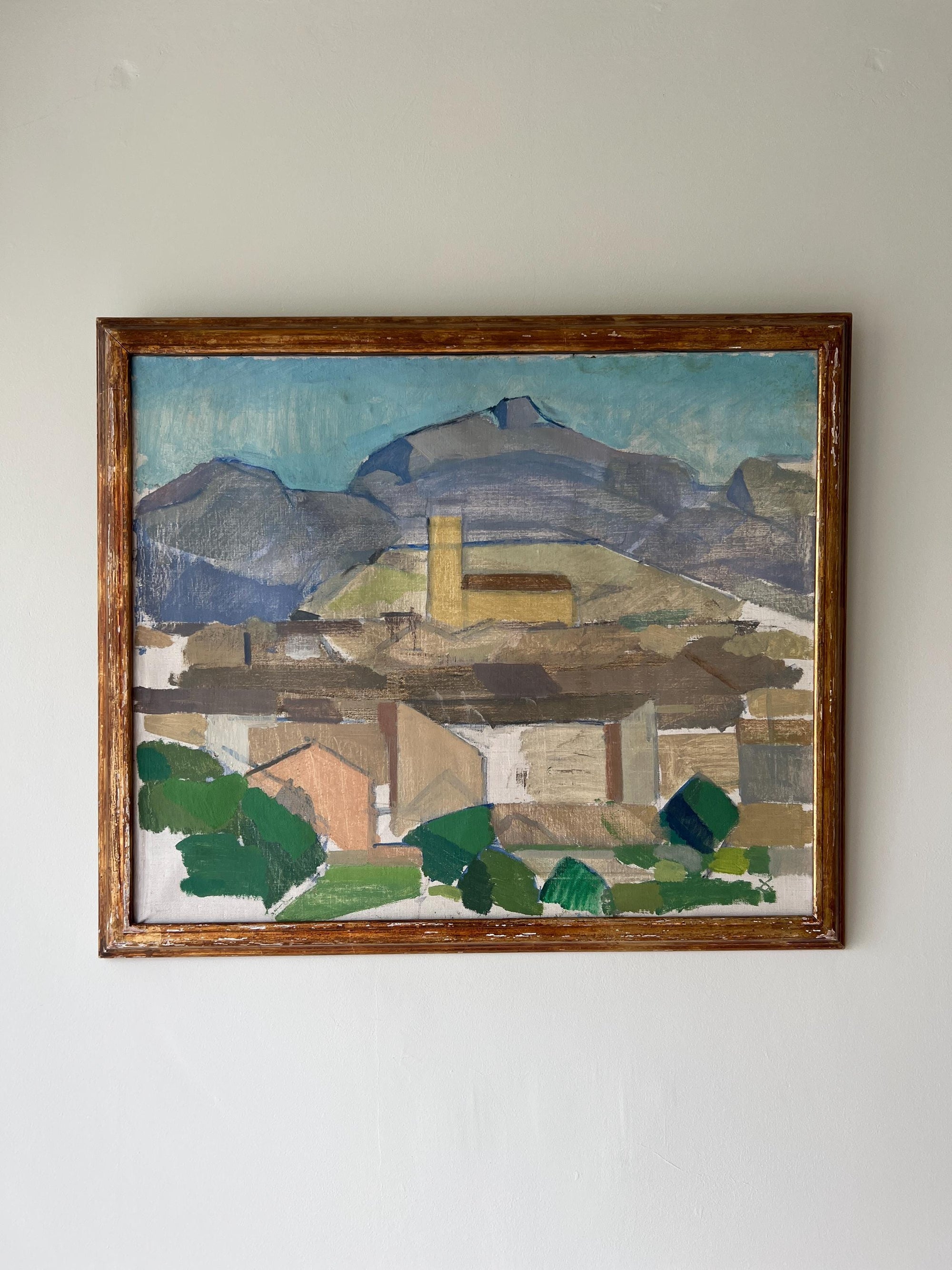 Framed painting of a mountainous landscape with buildings in a cubist style available from hue