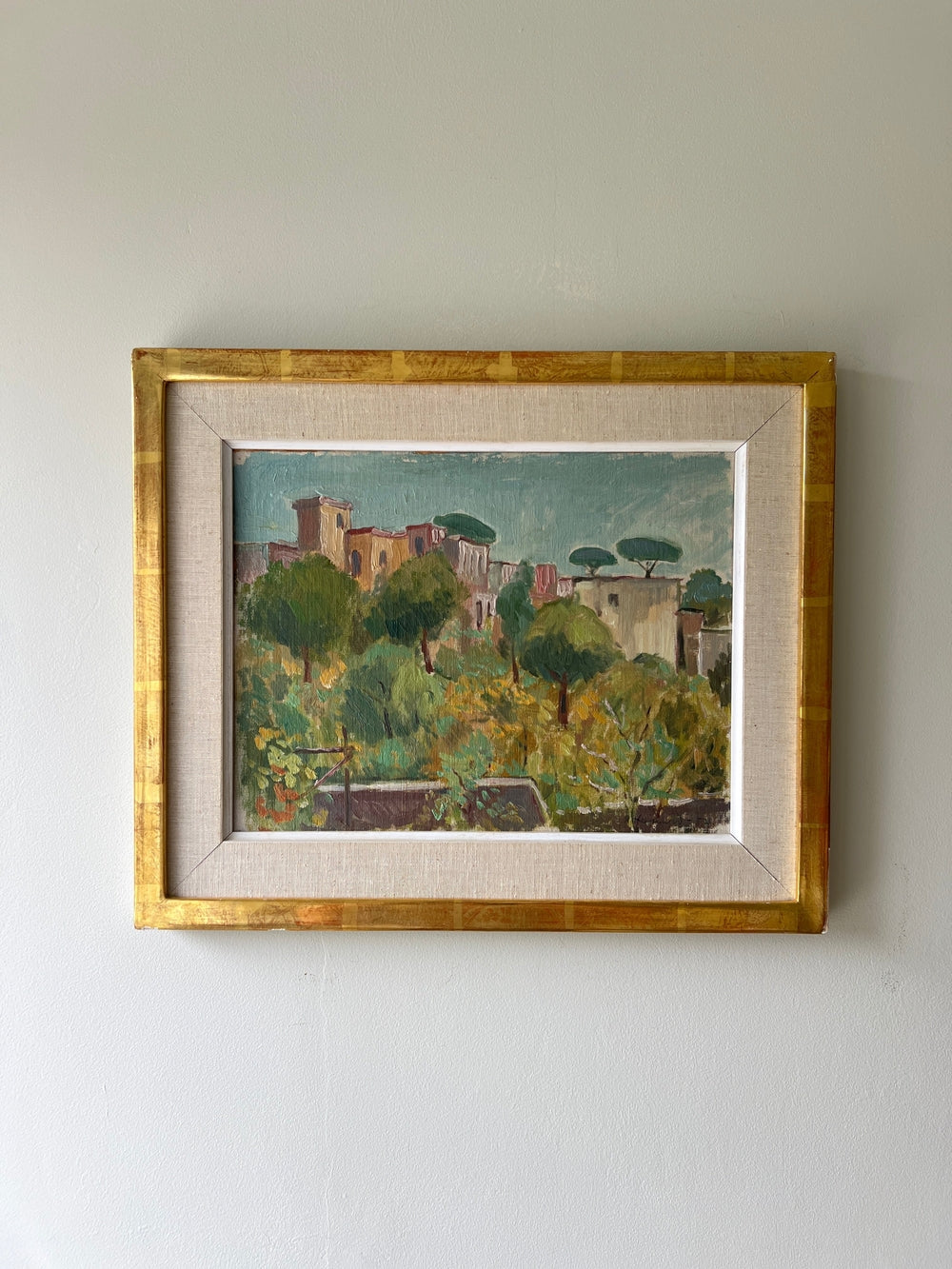 Framed painting of a landscape of capri, italy with trees and buildings on a white wall, available from hue
