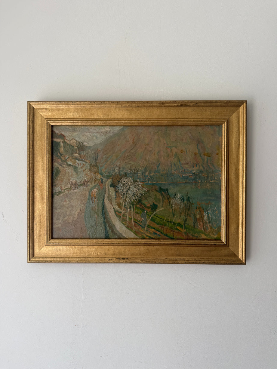 Framed vintage landscape oil painting of a lakeside scene in italy. Available at Hue. 