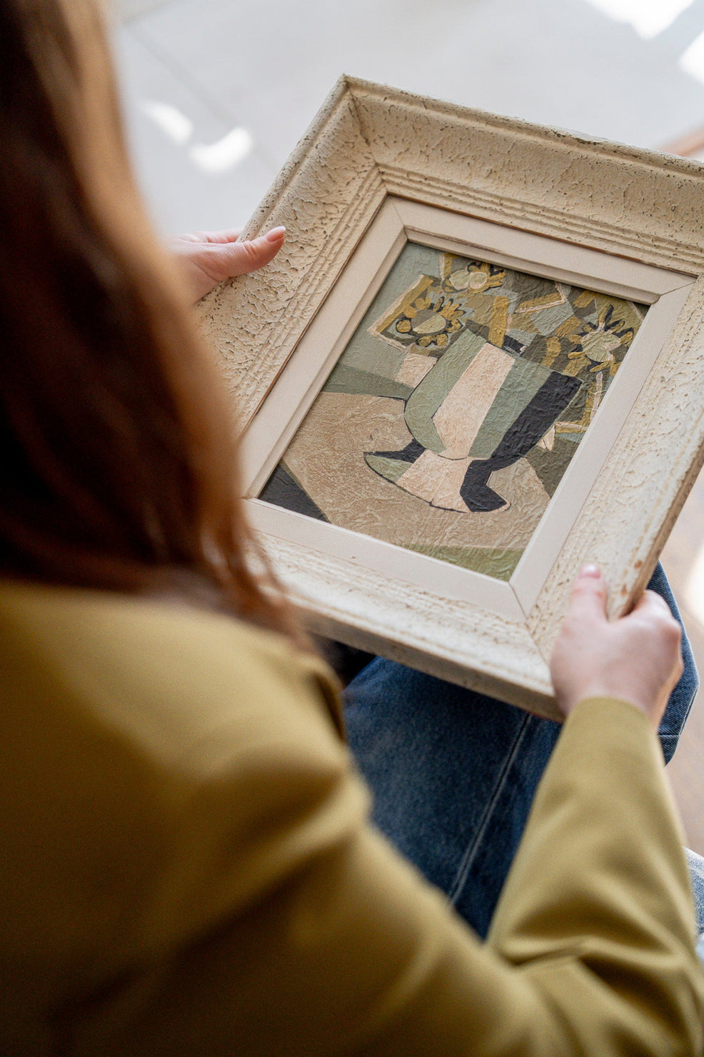 Original French mid-century vintage art featuring a framed abstract stil life painting held by a vintage art curator.