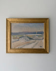 A framed vintage landscape oil painting. The artwork depicts a pale outdoor scene with muted blue, gray, beige, and green tones, enclosed in a gold-toned frame. Available at Hue. 
