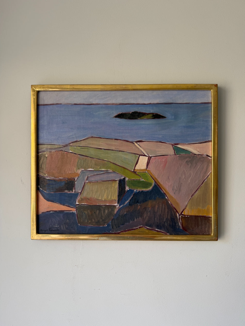A framed vintage landscape painting featuring geometric fields and a blue sea with an island. Available at Hue.