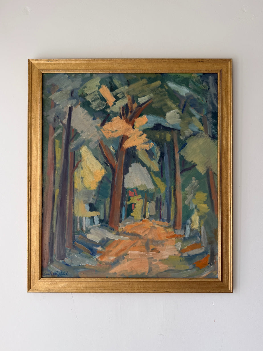 A framed vintage impressionist landscape painting of a forest path, featuring green and brown trees with orange and yellow highlights, enclosed in a gold frame. Available at Hue. 