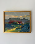 A framed vintage landscape oil painting. The painting depicts a red barn, green fields, and blue mountains under a cloudy sky, enclosed in a gold frame. Available at Hue.