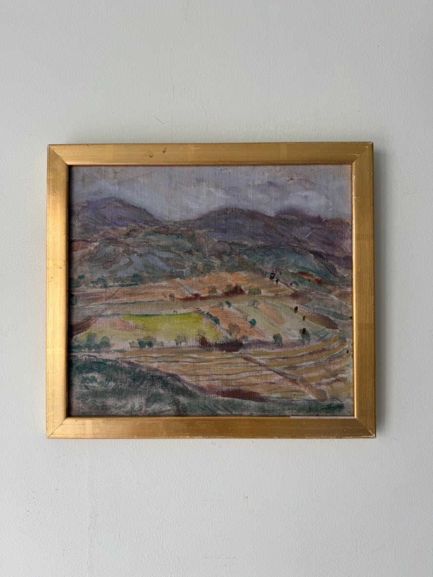 Framed vintage oil painting of a soft landscape scene with hills and fields. Available at Hue.