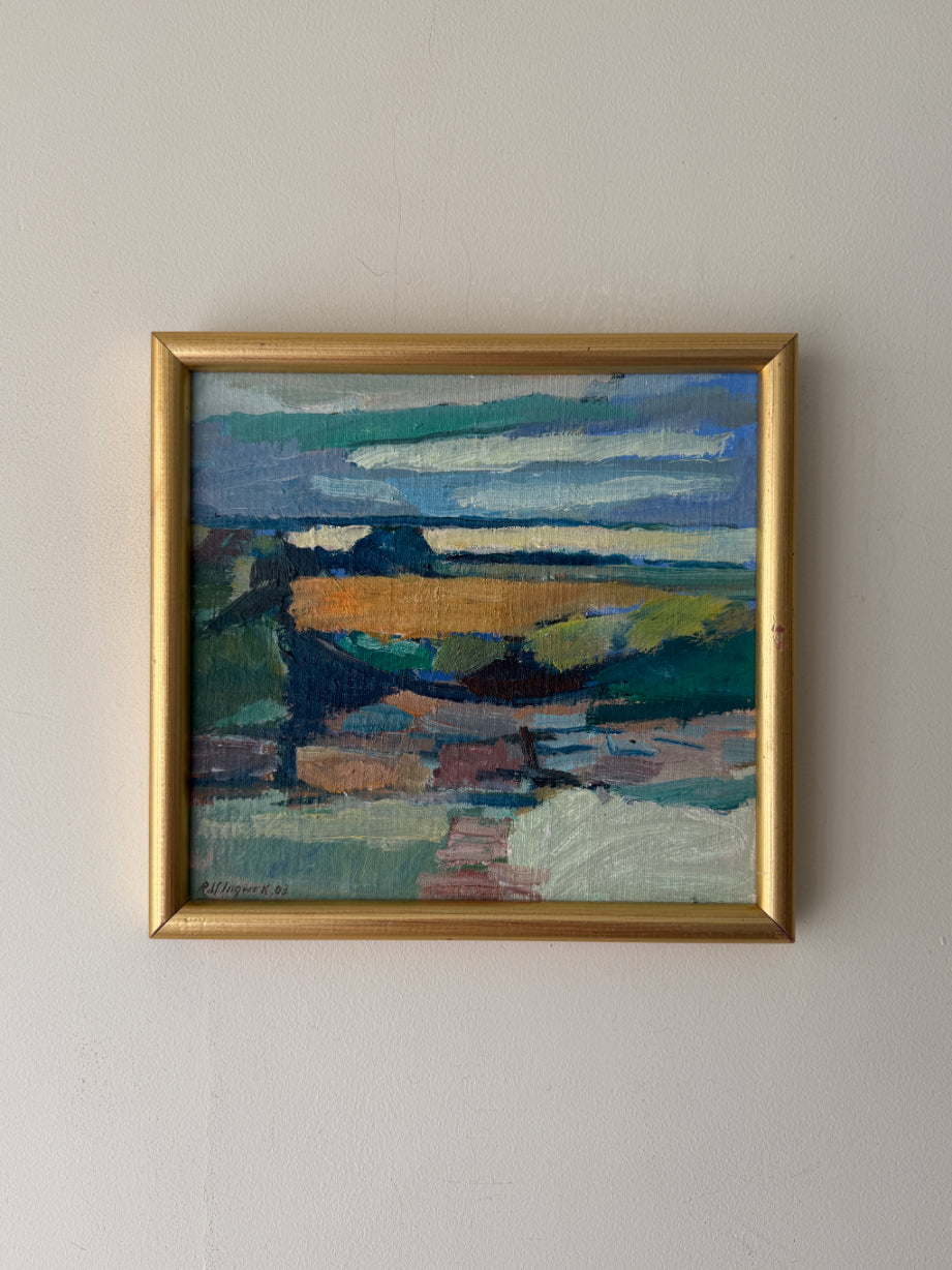 A framed landscape painting with an abstract coastal scene, featuring blue, green, brown, and gold tones, housed in a gold frame. Available at Hue. 