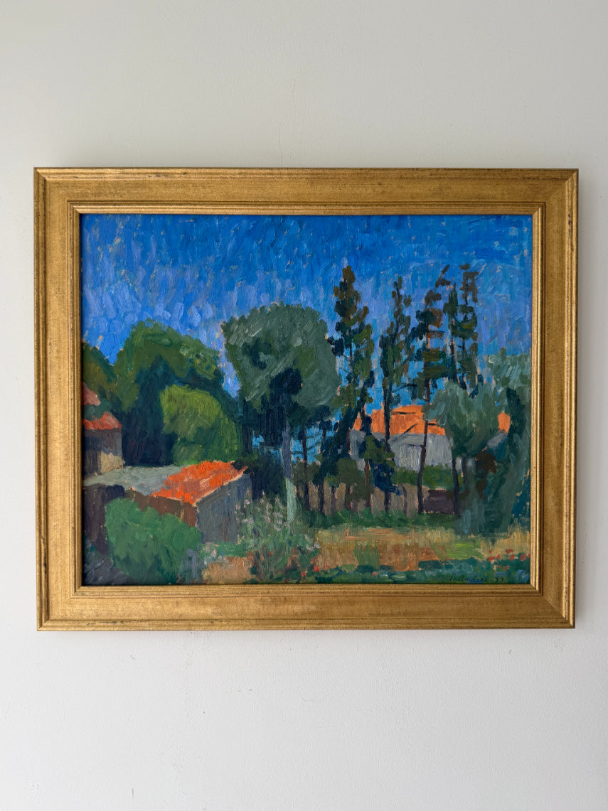 Framed vintage oil painting of a landscape with rural houses and trees under a vivid blue sky. Available at Hue. 