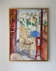 A framed vintage painting depicting a sunlit interior scene with a wicker chair, red doorframes. Available at Hue. 