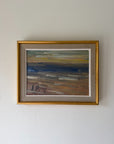 A framed vinatge landscape oil painting of a beach scene with blue water, sandy brown shore, and a gold frame. Available at Hue. 